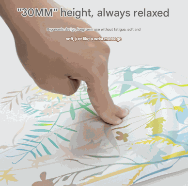 Mouse pad with Black Flower Pattern in pale botanical colors and a raised silicone gel wrist rest pressed by a finger