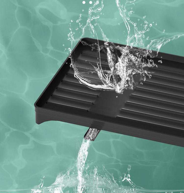 Black Foldable Dish Rack drain tray in black plastic with grooved channels and a removable water outlet