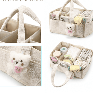 Black Large Plush Nappy Caddy described as a soft teddy-fleece organiser with dividers, carry handles and a bear-face detail; pictured in cream.