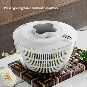 Black Manual Salad Spinner with a white plastic lid, smoky grey pump handle and white slotted basket bowl