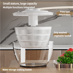 Black Manual Salad Spinner with a white press-pump lid and slotted basket inside a clear bowl for drying produce