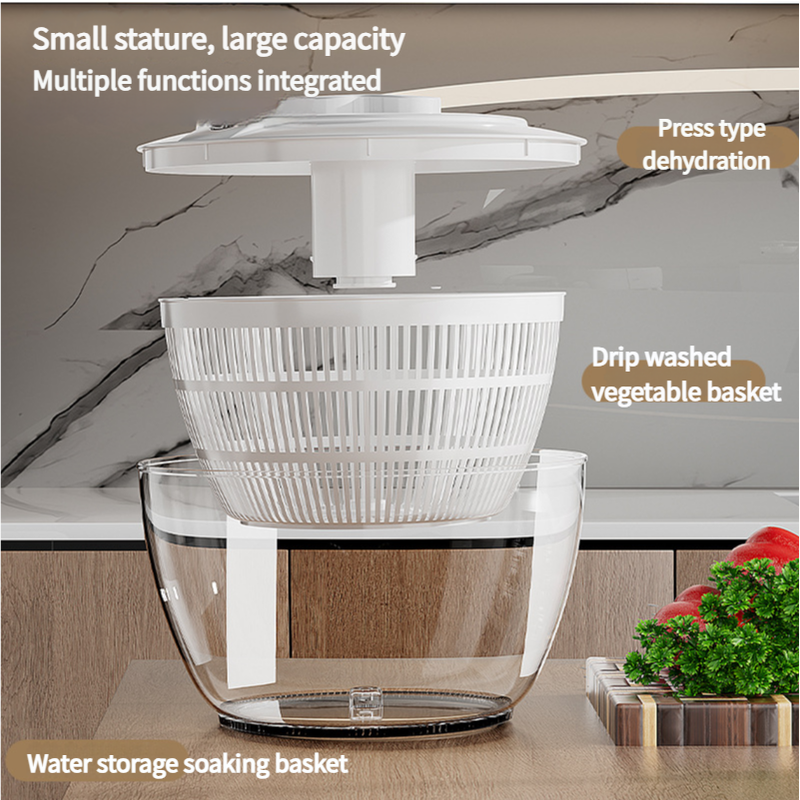 Black Manual Salad Spinner with a white press-pump lid and slotted basket inside a clear bowl for drying produce