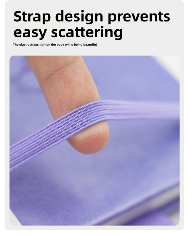 Black Password Log Book with a lilac cover and matching elastic closure strap stretched across the book