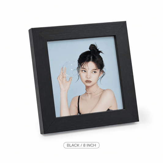 Photo frame, Black square 6-inch style, with a wide black textured border and clear front displaying a portrait.