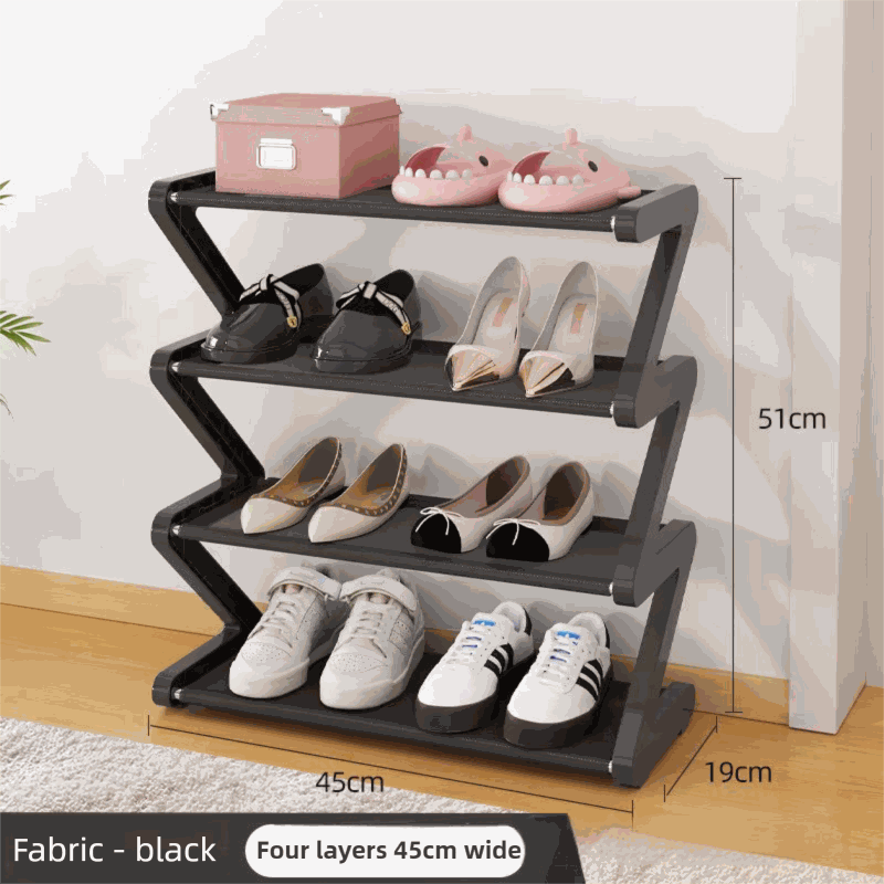 Black Stable Z-Shaped shoe rack with four black fabric tiers and a zigzag frame, displaying shoes and slippers