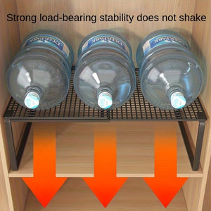 Black White adjustable mesh storage shelf with a black metal frame and slatted mesh top supporting three large water bottles