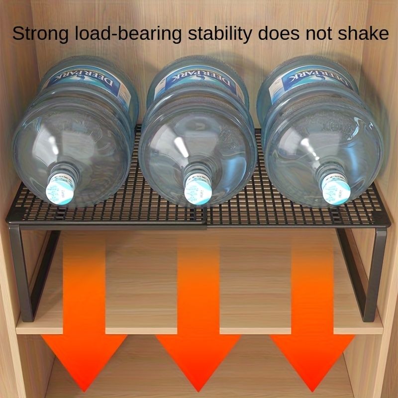 Black White adjustable mesh storage shelf with a black metal frame and slatted mesh top supporting three large water bottles
