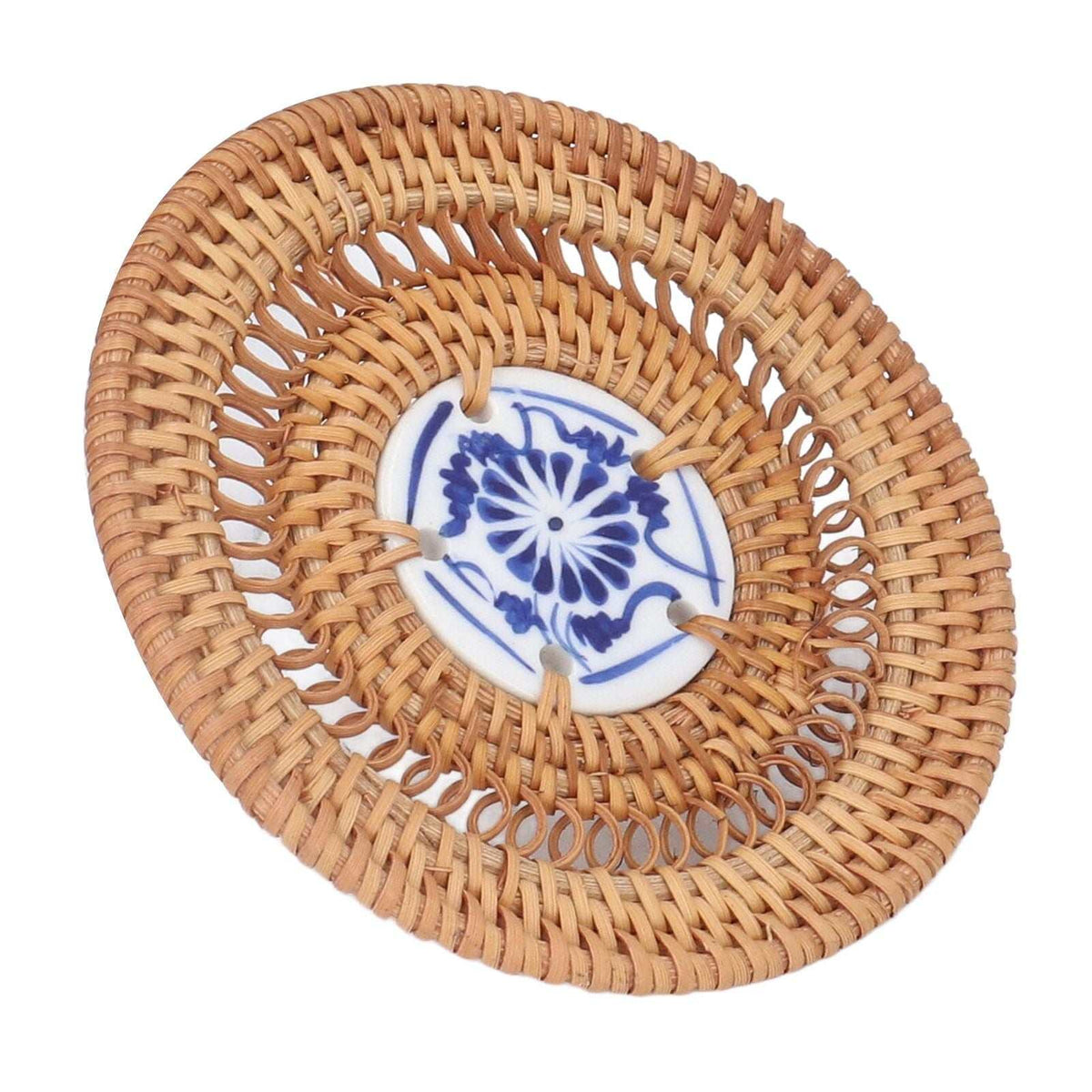Blue and White Porcelain Coaster with a blue floral porcelain centre framed by natural tan woven rattan