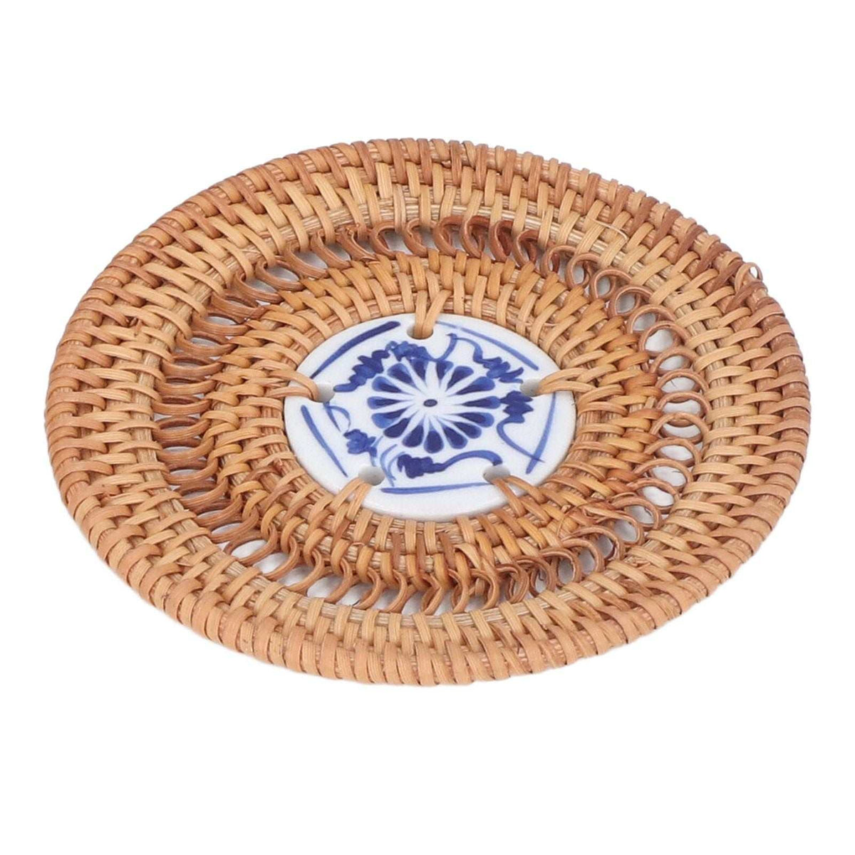Blue and White Porcelain Coaster with a round tan woven rattan frame and blue floral porcelain centre