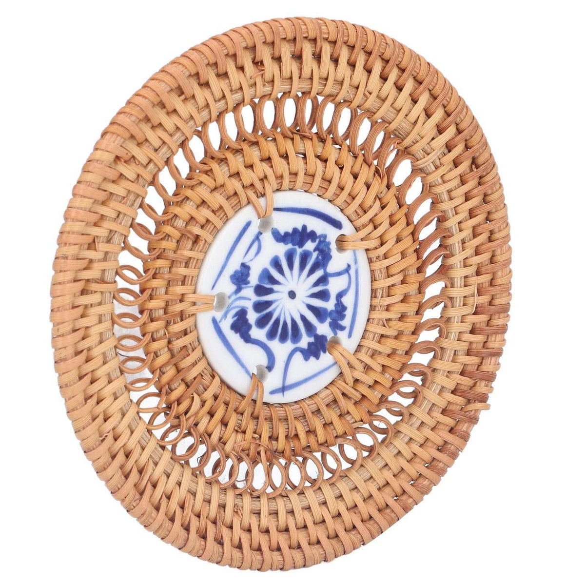 Blue and White Porcelain Coaster with a natural tan woven rattan surround and a blue floral porcelain center