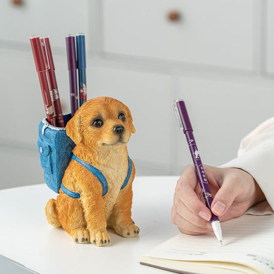 Blue Backpack Charming Golden Retriever Puppy pen holder in textured resin, with a golden puppy and bright blue backpack holding pens