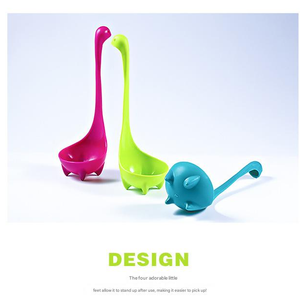 Blue Nessie Ladle in turquoise nylon with a long neck handle and four stubby feet, shown beside pink and lime ladles