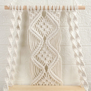 Boho Macrame Wall Hanging Shelf in natural cream cotton rope with intricate woven knots and a light wood dowel.