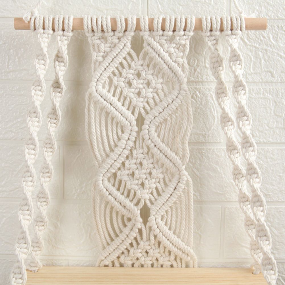 Boho Macrame Wall Hanging Shelf in natural cream cotton rope with intricate woven knots and a light wood dowel.