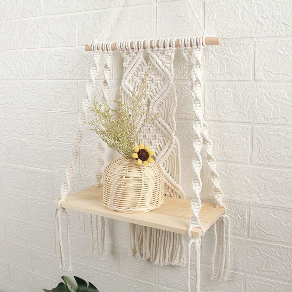 Boho Macrame Wall Hanging Shelf in cream cotton rope with intricate knots and a light beech wood shelf