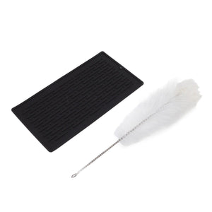 Bottle Drain Drying Rack with a black ridged silicone drainage pad and a white bottle-cleaning brush with metal handle