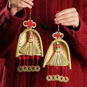 Broom Dustpan Decor ornament in woven golden straw, with a miniature broom, arched dustpan, red knots and coin charms