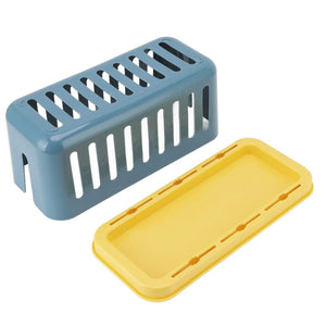 Cable Organizer Box in blue plastic with elongated ventilation slots, shown beside a separate yellow lid
