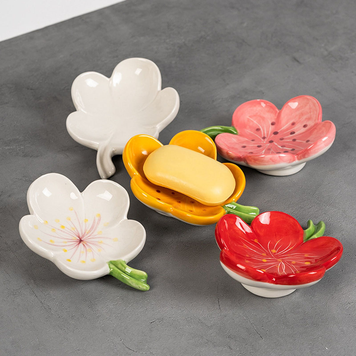 Ceramic Leaf Soap Box dishes in white, pink, red and yellow, with glossy flower-shaped bowls and a bar of soap