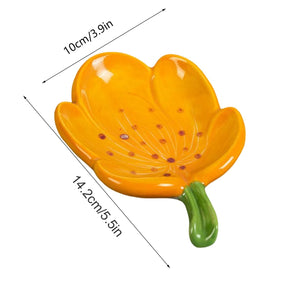 Ceramic Leaf Soap Box in glossy orange ceramic, shaped like a flower-like leaf with a green stem and raised drainage grooves