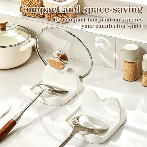 Ceramic Spoon Rest in glossy cream white with divided grooves, holding a glass pot lid and cooking utensils