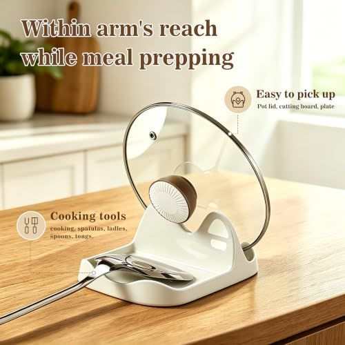 Ceramic Spoon Rest in cream white with a divided utensil groove and upright pot lid holder, shown with a glass lid and cooking tools