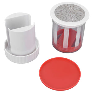 Cheese Grater Home Kitchen with a red plastic cylinder, stainless steel grating top and white plastic holder and red lid