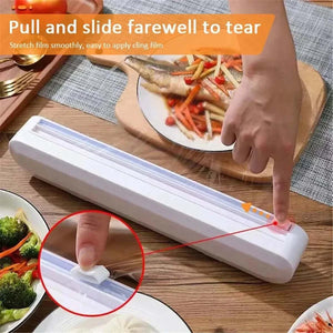 Cling Film Cutter Box in white ABS plastic featuring a sliding blade and suction cup base for secure countertop use