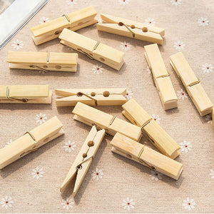 Clothes Pegs made from pale natural bamboo with metal springs, shown as multiple sturdy wooden clips