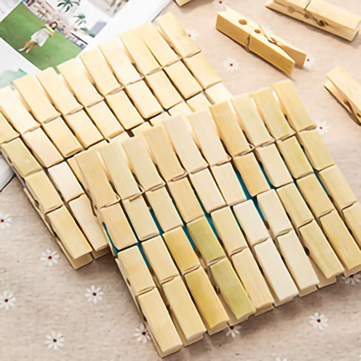 Clothes Peg in natural pale bamboo, featuring rectangular wooden jaws and metal springs in a neatly arranged pack