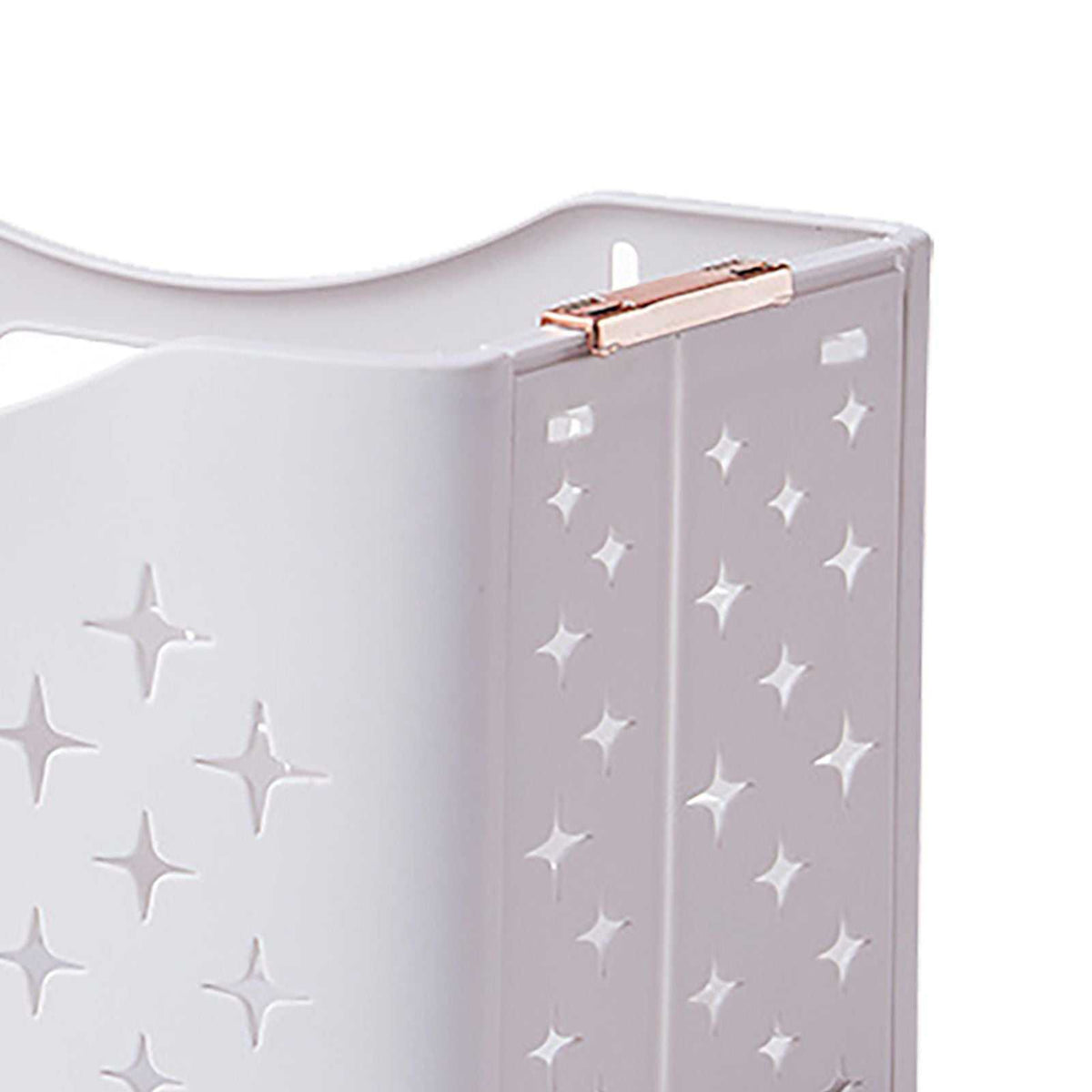 Collapsible Laundry Basket in pale rose-toned plastic with raised star patterns and a rose gold folding hinge