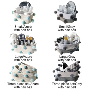 Cotton rope storage baskets in azure and grey with textured fur ball accents, shown in small, large and three-piece sets