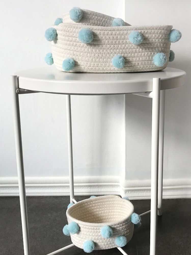 Cotton Rope Knitting storage baskets in cream woven cotton with light blue pom-pom accents, shown in two sizes