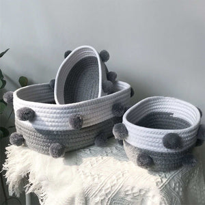 Cotton Rope Knitting storage baskets in white and grey woven cotton with fluffy grey pom-pom accents