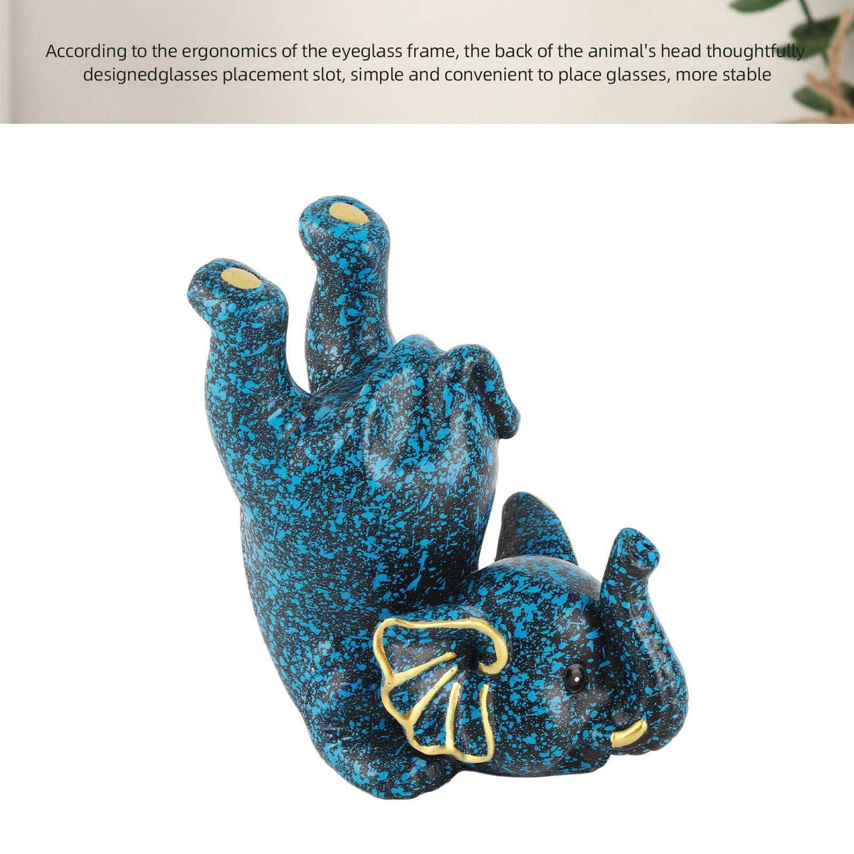 Creative Attraction Small Elephant eyeglasses holder in blue speckled resin, shaped as a reclining elephant with gold details