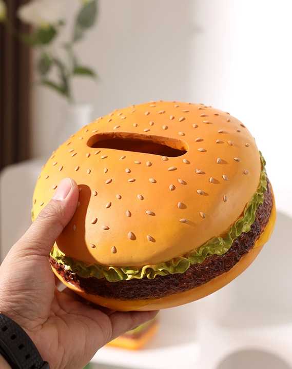 Creative Burger Tissue Box in orange plastic, shaped like a sesame seed bun with lettuce and patty details and a tissue slot
