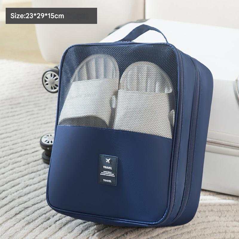 Dark Blue Waterproof Foldable travel shoe bag in navy fabric with a mesh window, carrying handle and visible shoes inside