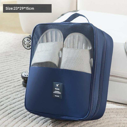 Dark Blue Waterproof Foldable travel shoe bag in navy fabric with a mesh window, carrying handle and visible shoes inside