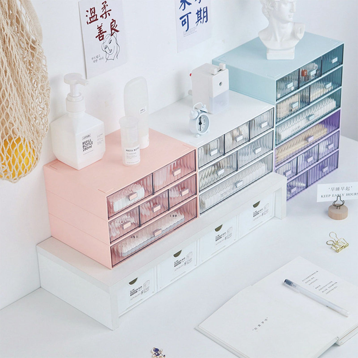 Desktop Drawer Organizer in pastel pink and blue plastic with clear striped fronts and multiple stackable drawers