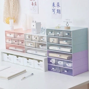 Desktop Drawer Organizer in a stackable plastic design, featuring striped translucent drawers in white, blue, pink and purple