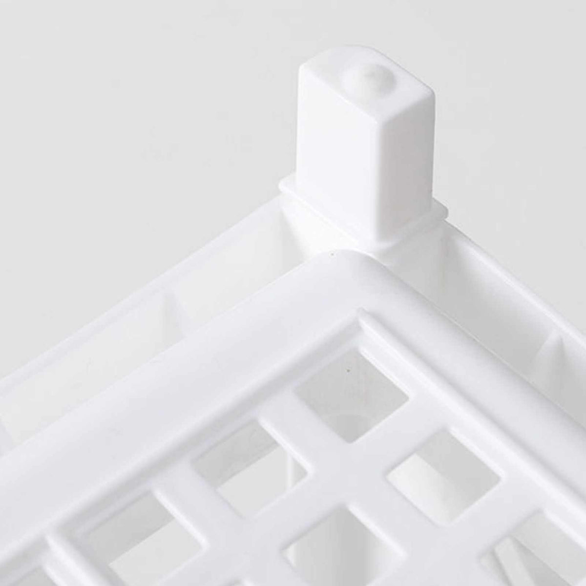 Desktop Storage Shelf Multifunctional in white plastic, showing a raised corner post and an open lattice shelf surface.