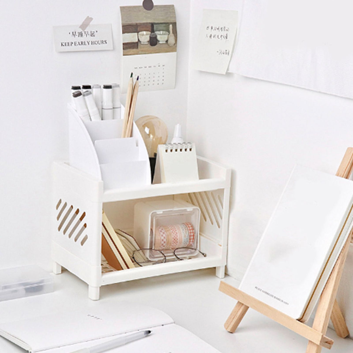 Desktop Storage Shelf Multifunctional white plastic two-tier organizer with slotted sides and compartments holding stationery