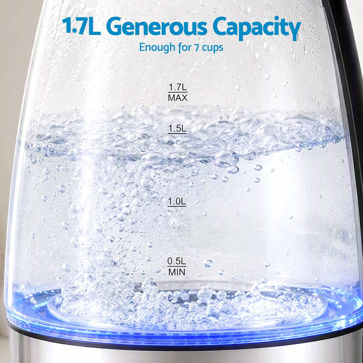 Devanti 1.7L Glass Electric Kettle with a clear glass body, visible water level markings and blue LED base while boiling