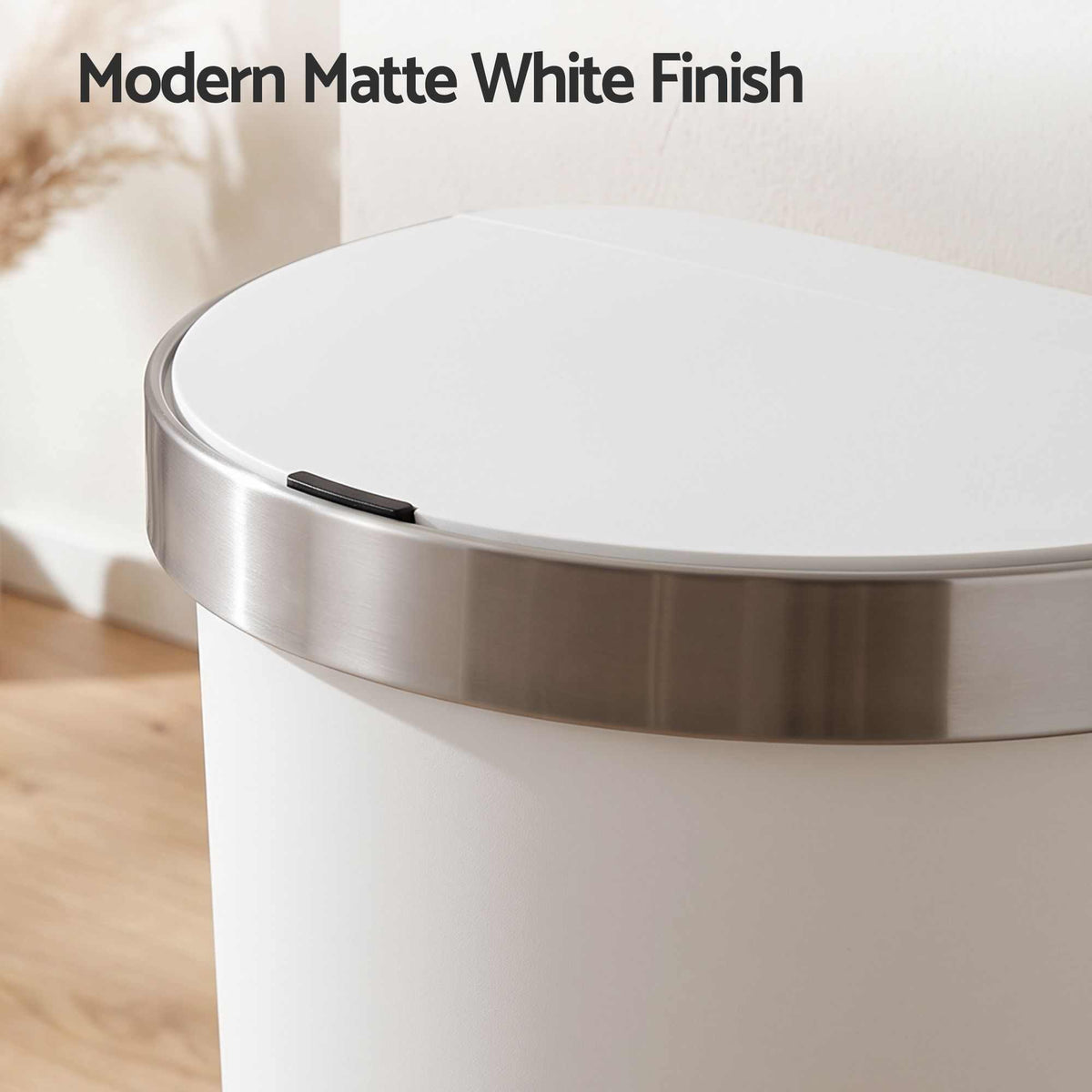 Devanti 50L Motion Sensor Bins features a matte white plastic body, stainless steel rim and D-shaped lid
