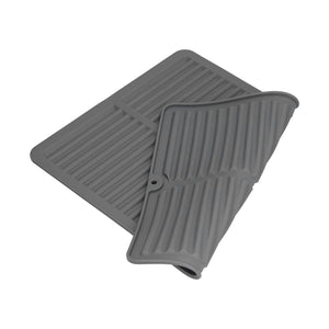 Dish Drying Mat in dark gray silicone with a ribbed surface, wide edges, and a flexible rolled corner.