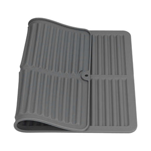 Dish Drying Mat in dark grey silicone with a ribbed drainage surface, raised edges and foldable design
