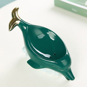 Dolphin Ceramic Soap Box in glossy deep teal ceramic, with a sculpted dolphin shape and drainage holes