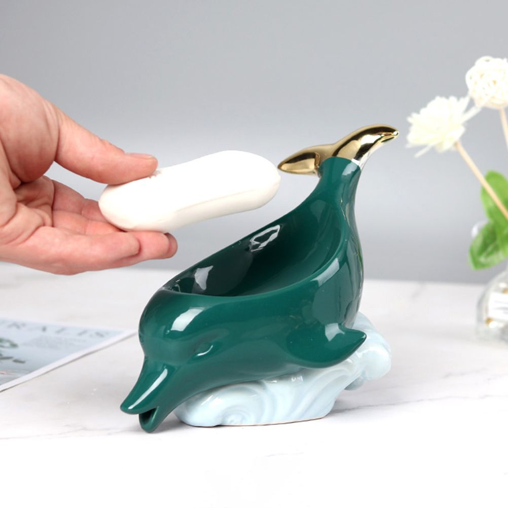 Dolphin Ceramic Soap Box in glossy teal ceramic with gold accents, sculpted dolphin shape and white wave base