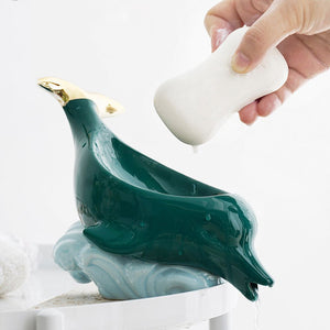 Dolphin Ceramic Soap Box with glossy teal ceramic dolphin-shaped holder, pale blue wave base and gold accents