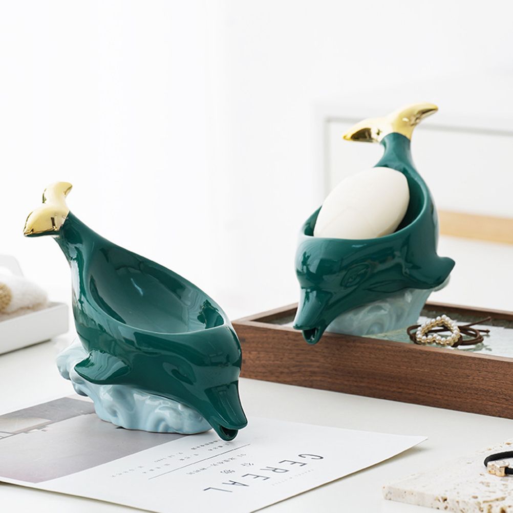 Dolphin Ceramic Soap Box in glossy teal ceramic, sculpted dolphin shape with pale yellow head details and a soap bar